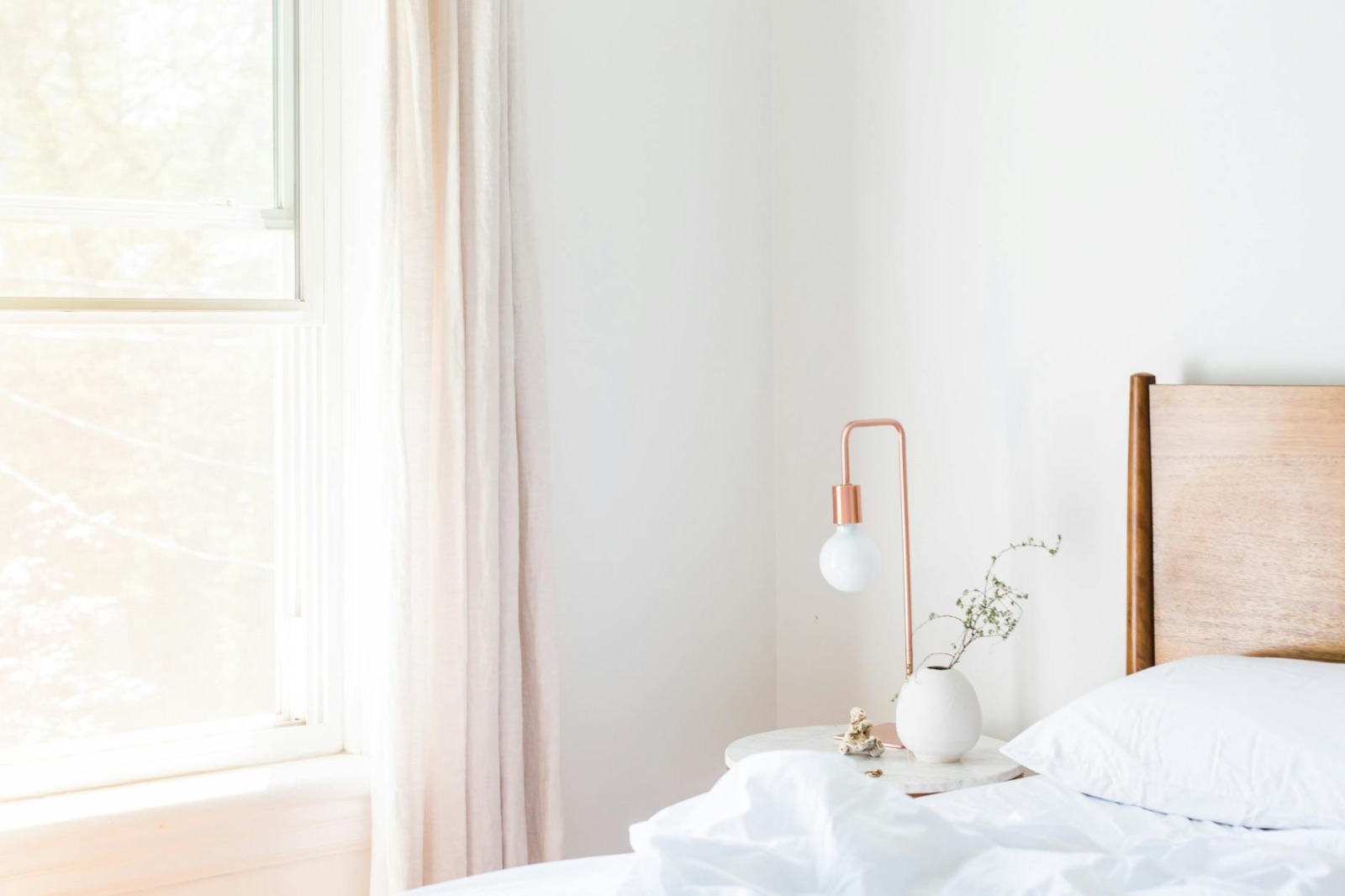 A bright, peaceful bedroom with soft morning light — the feeling we want to leave behind in your home.
